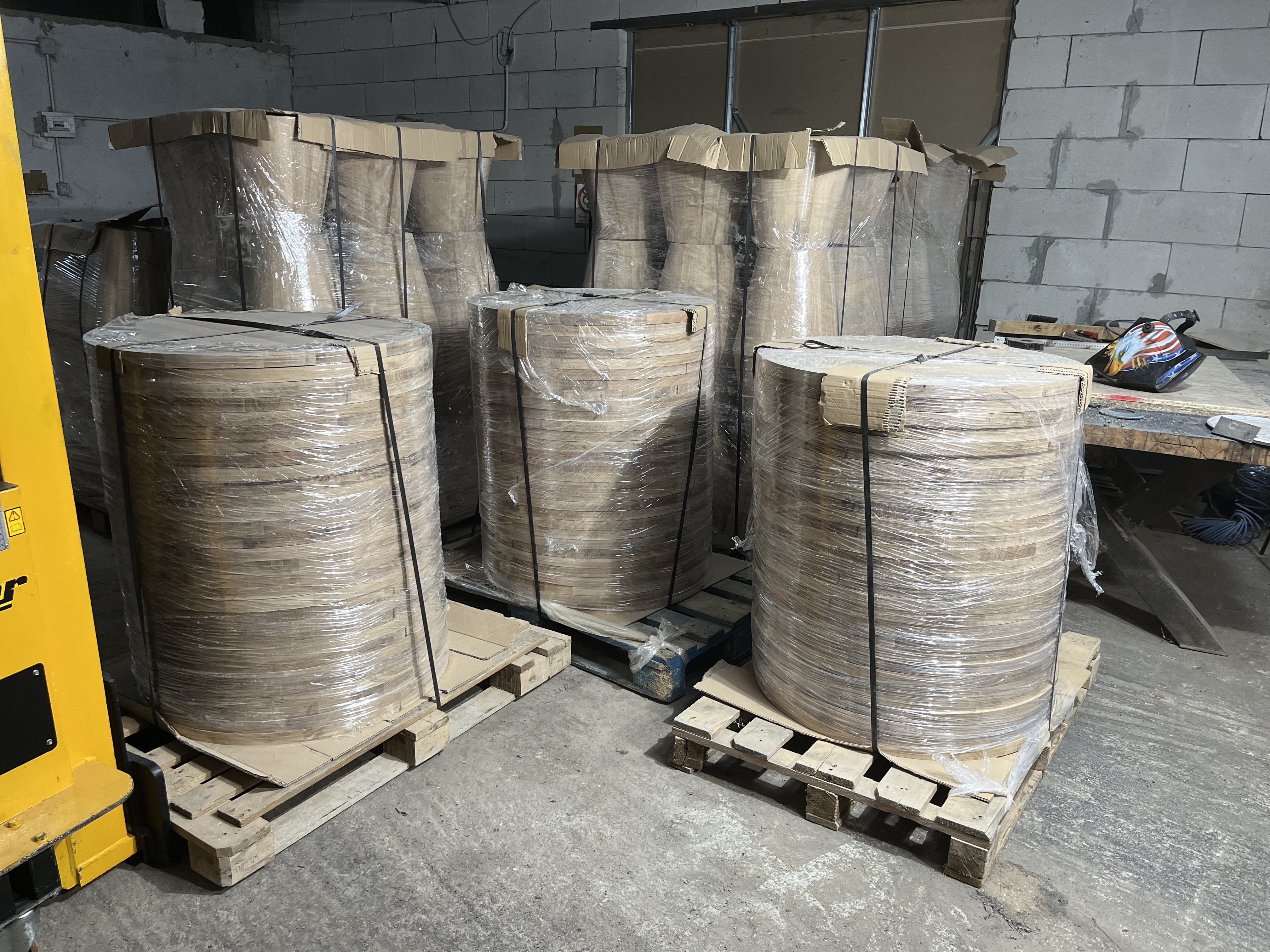 Hotel furniture bases packaged on pallets ready for export, European production facility