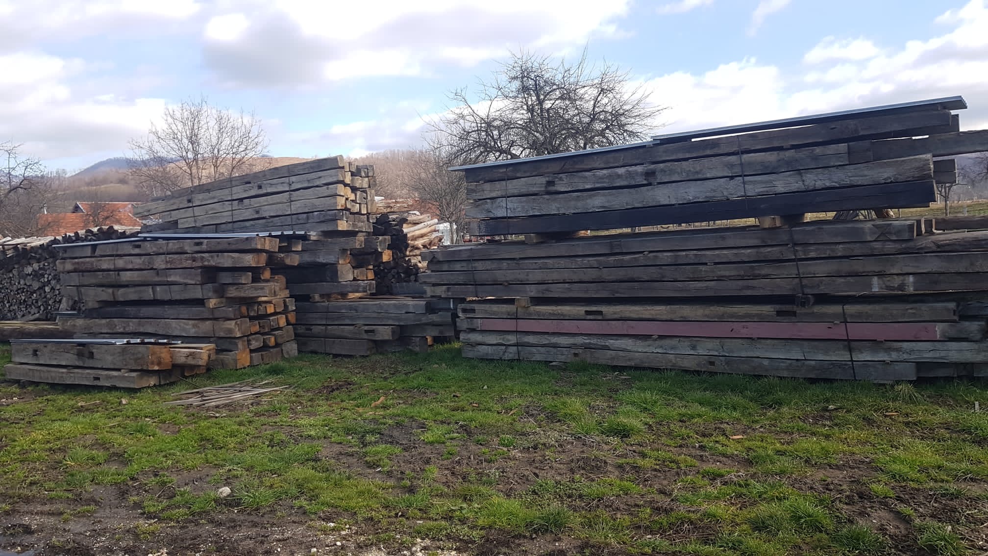Antique dark patina oak beams from European demolitions, hand-hewn historic timber