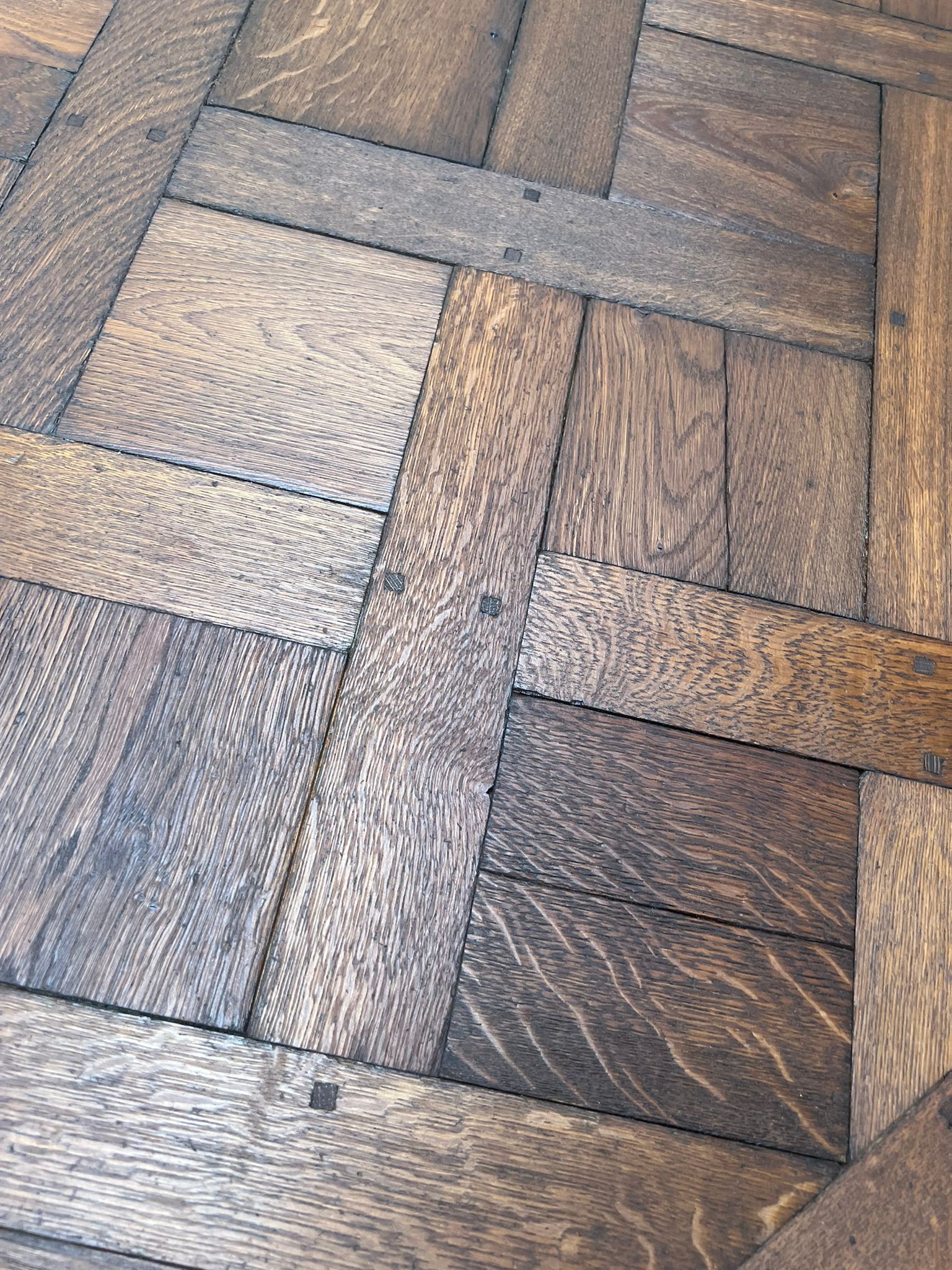 Antique Versailles oak parquet floor detail, original patina, close view