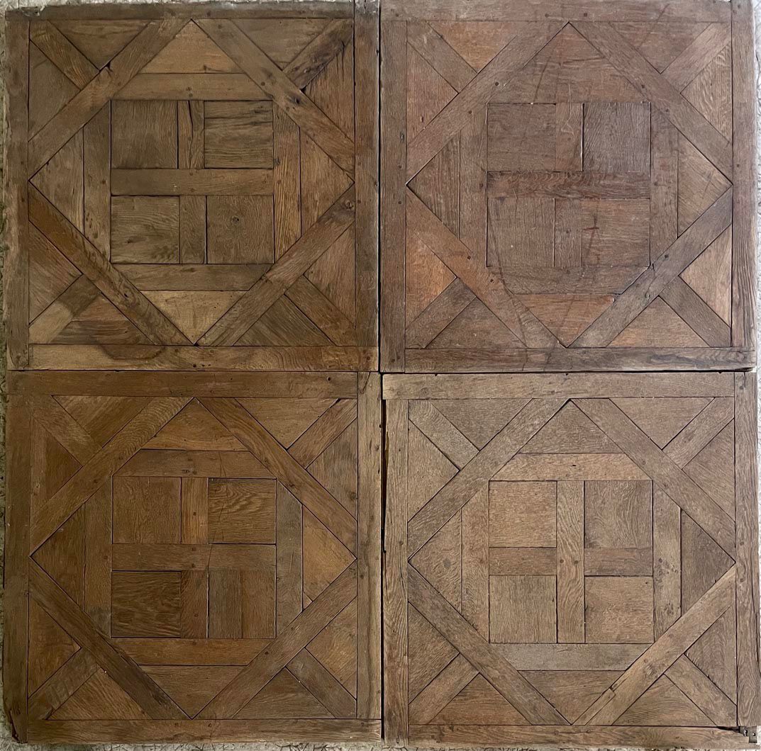 Four Versailles oak parquet panels assembled, antique patina